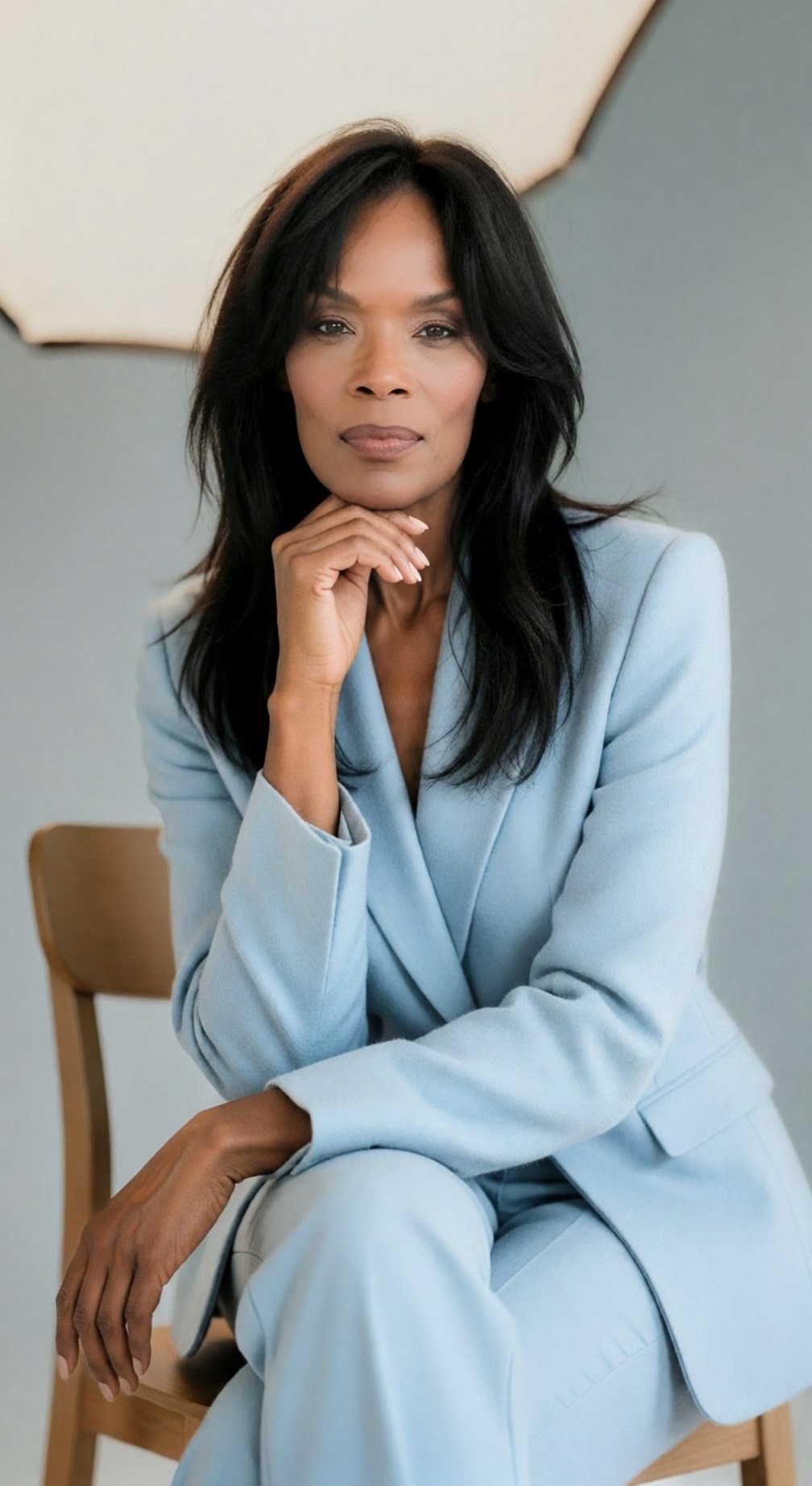 Jennifer E. Mahone-Rightler, Founder and CEO of RightStar Consulting Partners LLC, seated in a light blue suit.